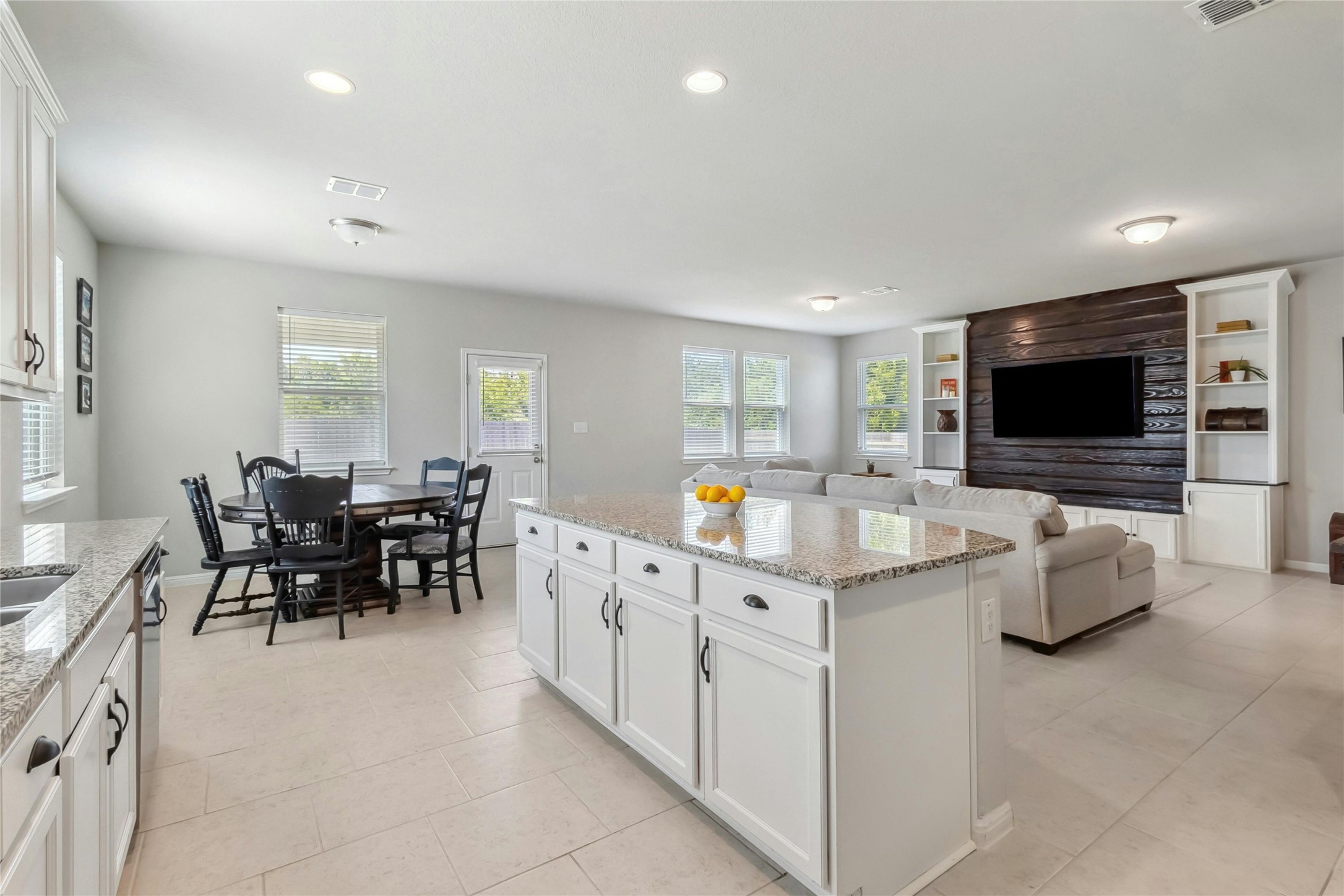 112 Silver Spgs Bend Kyle, TX 78640 - Photo 32 of 33 Incredibly spacious and open floor plan. Dining area easily accommodates 6-8. Beautiful accent wall with flanking bookcases to display decorative heirlooms.