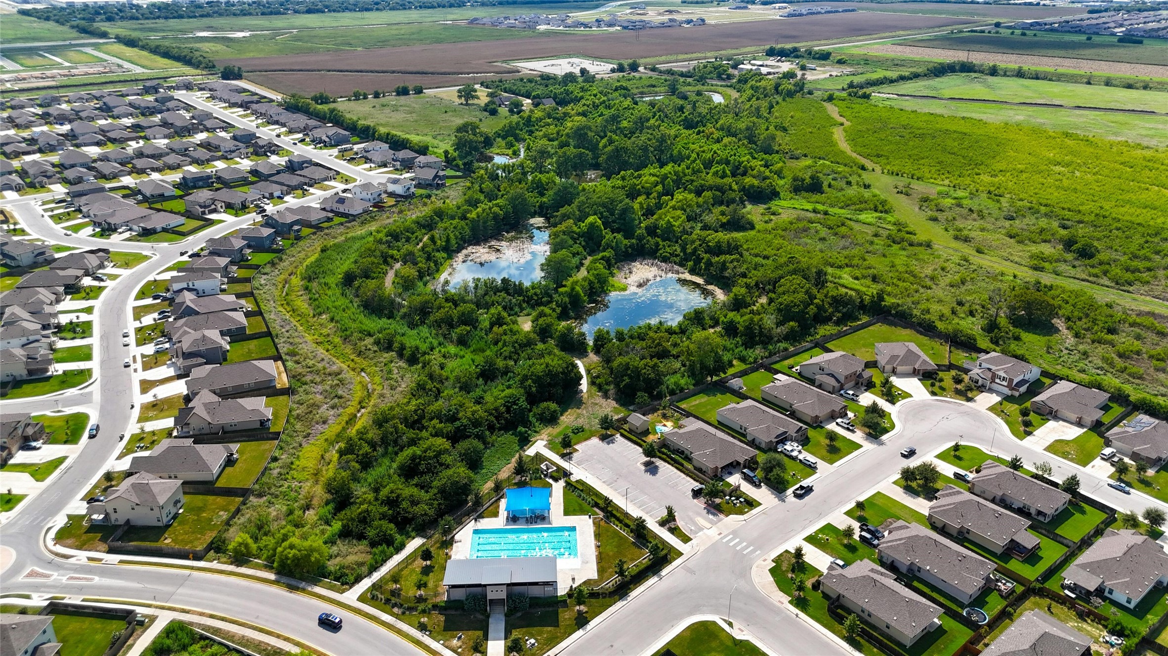 112 Silver Spgs Bend Kyle, TX 78640 - Photo 4 of 33 Walking distance to the neighborhood pool, just around the bend and down the street!