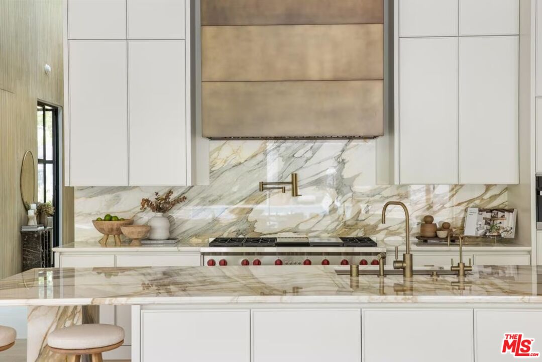 740 Warner Avenue Los Angeles, CA 90024 - Photo 12 of 53 a bathroom with a sink and a mirror