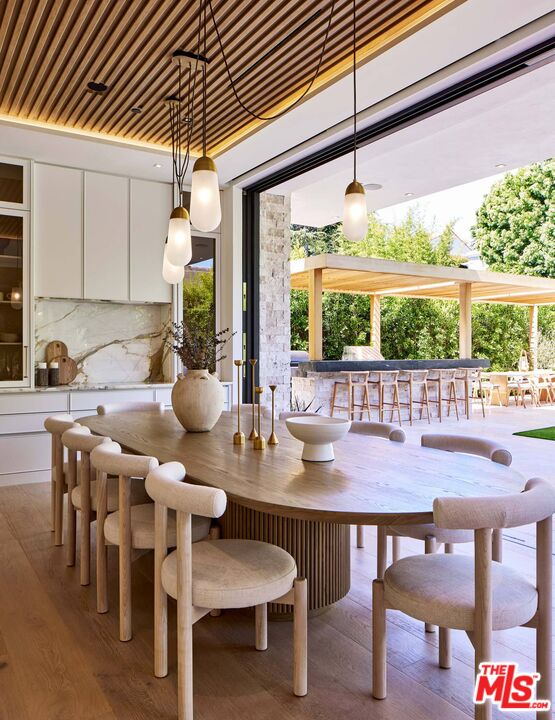 740 Warner Avenue Los Angeles, CA 90024 - Photo 15 of 53 a view of a dining room with furniture window and outside view