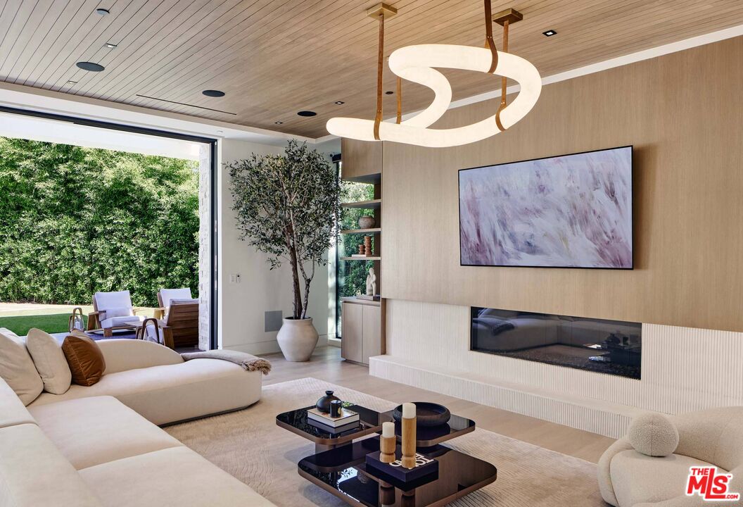 740 Warner Avenue Los Angeles, CA 90024 - Photo 17 of 53 a living room with furniture and a large window