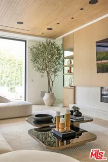 a living room with a couch and a large window