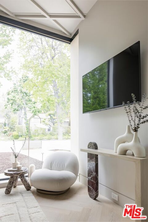 740 Warner Avenue Los Angeles, CA 90024 - Photo 22 of 53 a living room with furniture and a flat screen tv