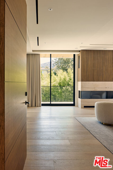 740 Warner Avenue Los Angeles, CA 90024 - Photo 24 of 53 an empty room with wooden floor and windows