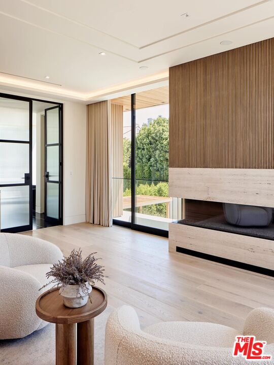 740 Warner Avenue Los Angeles, CA 90024 - Photo 25 of 53 a living room with furniture and a fireplace