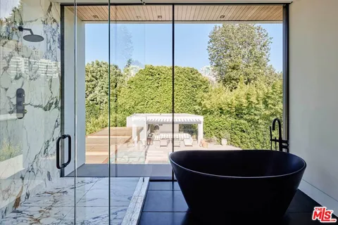 a room with a table and a large window