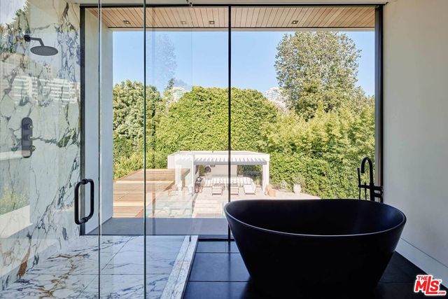 a room with a table and a large window