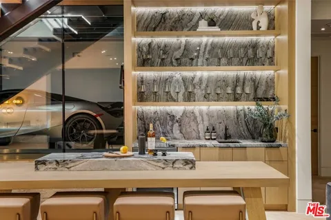 a kitchen with a stove a sink and a refrigerator