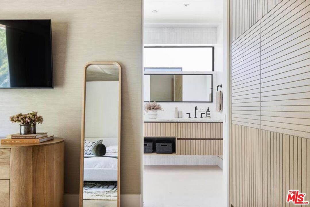 740 Warner Avenue Los Angeles, CA 90024 - Photo 50 of 53 a bathroom with a sink and a mirror