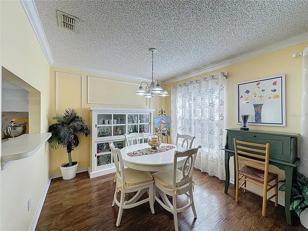 a kitchen with cabinets stainless steel appliances and a sink