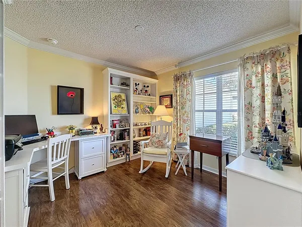 a workspace with furniture and a wooden floor