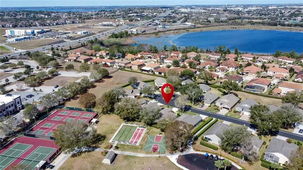 a lobby with furniture and a flat screen tv
