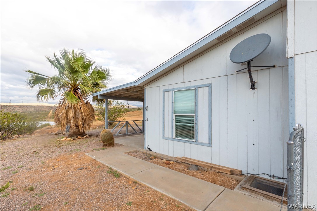 7374 Windmill Road Kingman, AZ 86401 - Photo 11 of 49 a view of potted plants in front of door