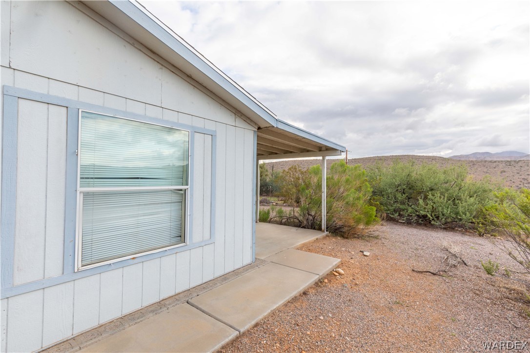 7374 Windmill Road Kingman, AZ 86401 - Photo 12 of 49 a view of a glass door with a yard