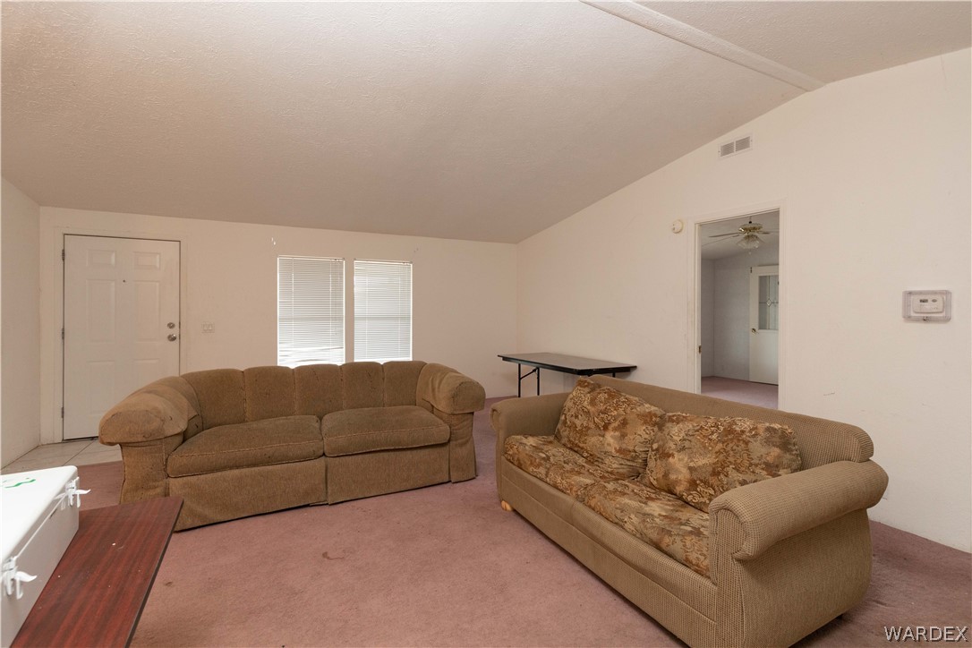 7374 Windmill Road Kingman, AZ 86401 - Photo 15 of 49 a living room with furniture and a couch