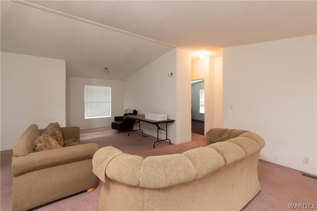 7374 Windmill Road Kingman, AZ 86401 - Photo 16 of 49 a living room with furniture and a couch