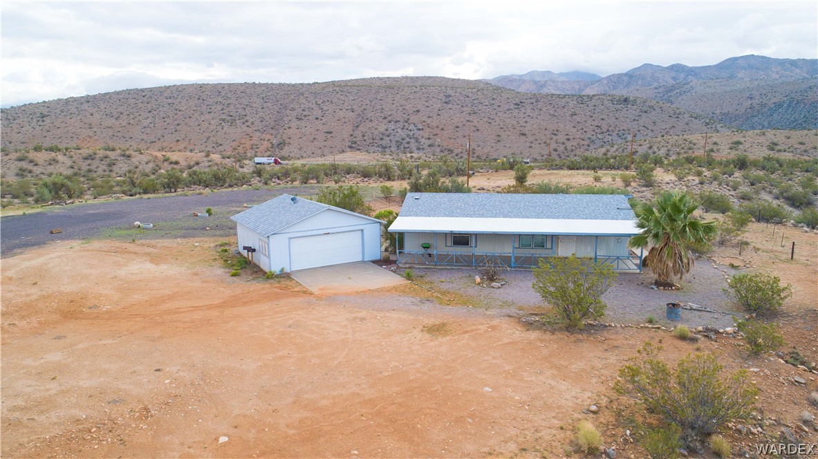 7374 Windmill Road Kingman, AZ 86401 - Photo 2 of 49 an aerial view of houses with a yard