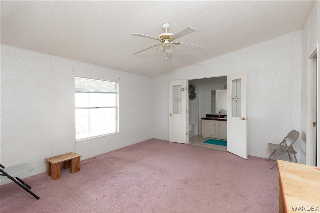 7374 Windmill Road Kingman, AZ 86401 - Photo 22 of 49 a view of an empty room with a window