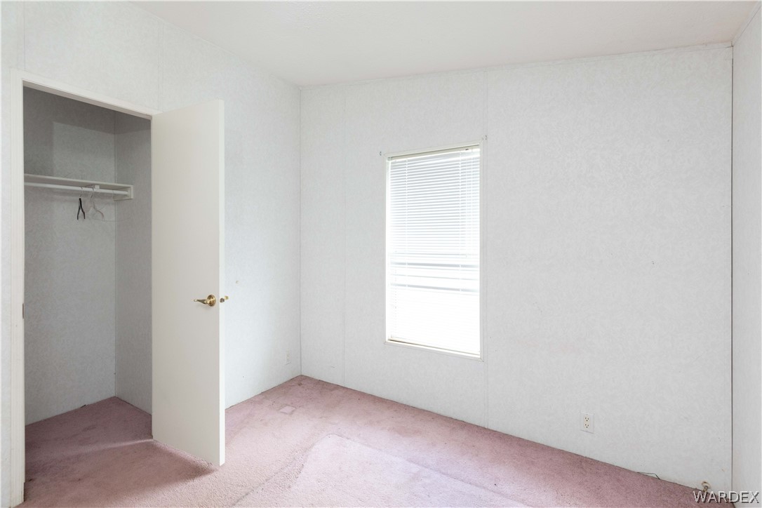 7374 Windmill Road Kingman, AZ 86401 - Photo 28 of 49 an empty room with windows
