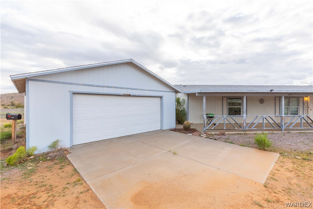 7374 Windmill Road Kingman, AZ 86401 - Photo 3 of 49 a front view of house with yard and seating space