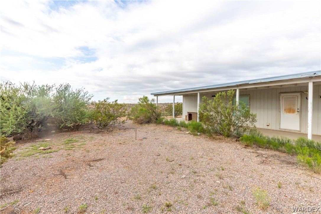 7374 Windmill Road Kingman, AZ 86401 - Photo 37 of 49 a view of a house with backyard and garden