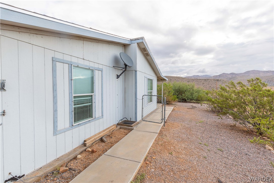 7374 Windmill Road Kingman, AZ 86401 - Photo 10 of 49 a view of a house with a backyard