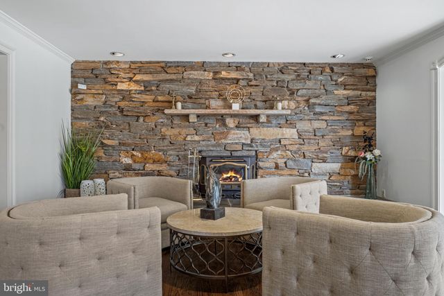 a kitchen with stainless steel appliances granite countertop a sink a stove and cabinets