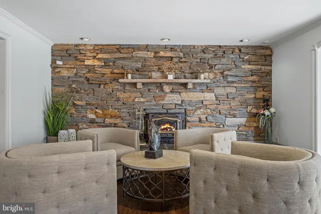 a kitchen with stainless steel appliances granite countertop a sink a stove and cabinets