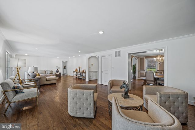 a kitchen with stainless steel appliances granite countertop a sink a stove and a microwave