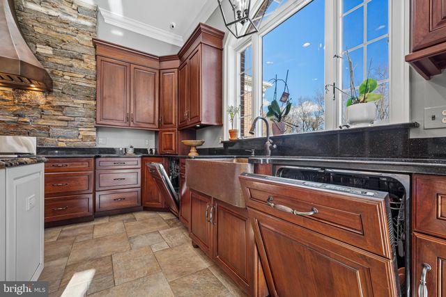 a kitchen with a stove a sink and a refrigerator