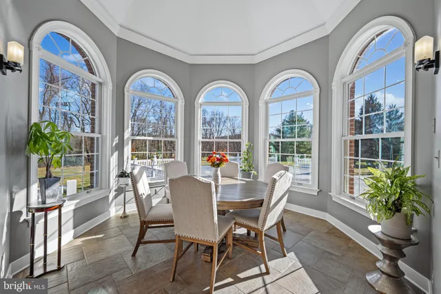 a bathroom with a granite countertop toilet a sink and a mirror