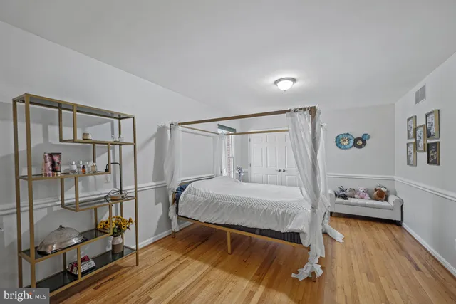 an aerial view of a house with a yard and balcony