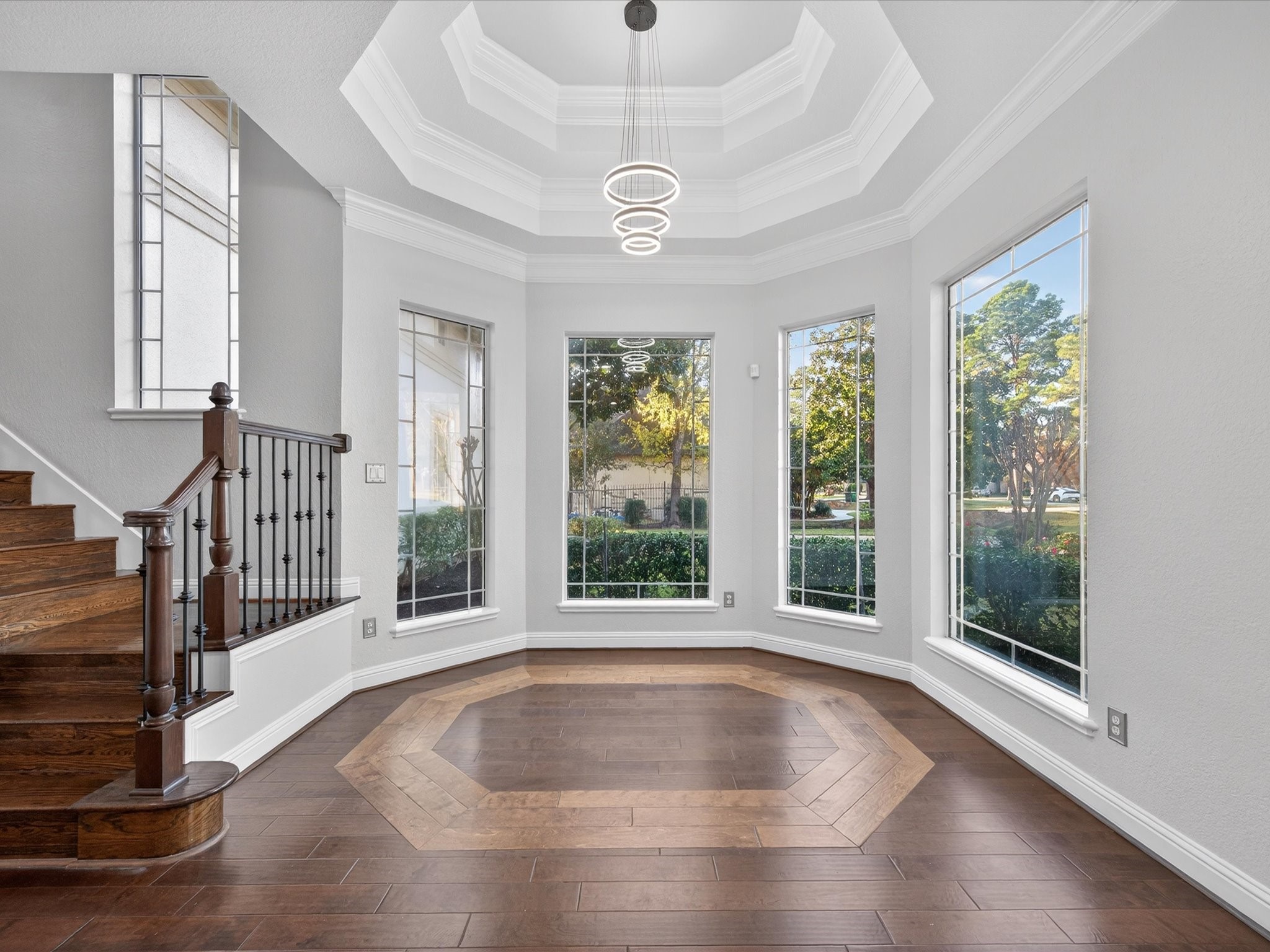 11 Gleannloch Estates Drive Spring, TX 77379 - Photo 15 of 50 The breakfast nook is bright and welcoming, with a recessed tray ceiling, crown molding, custom lighting, and panoramic views of the grounds.