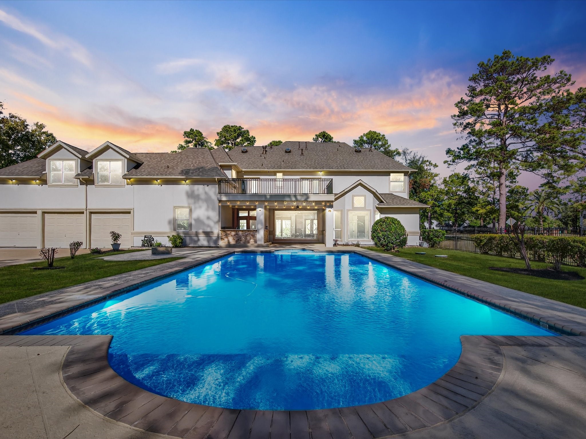 11 Gleannloch Estates Drive Spring, TX 77379 - Photo 2 of 50 Relax or entertain in the luxurious outdoor heated pool and spa, overlooking expansive, manicured grounds.