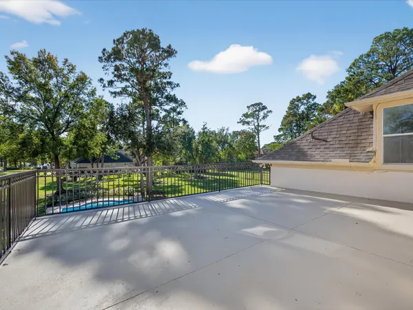 a view of a swimming pool with a patio