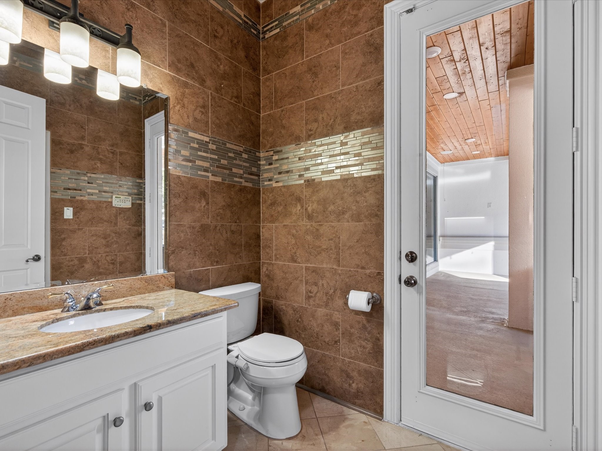 11 Gleannloch Estates Drive Spring, TX 77379 - Photo 35 of 50 The pool bathroom provides convenient access for backyard entertaining and poolside activities.