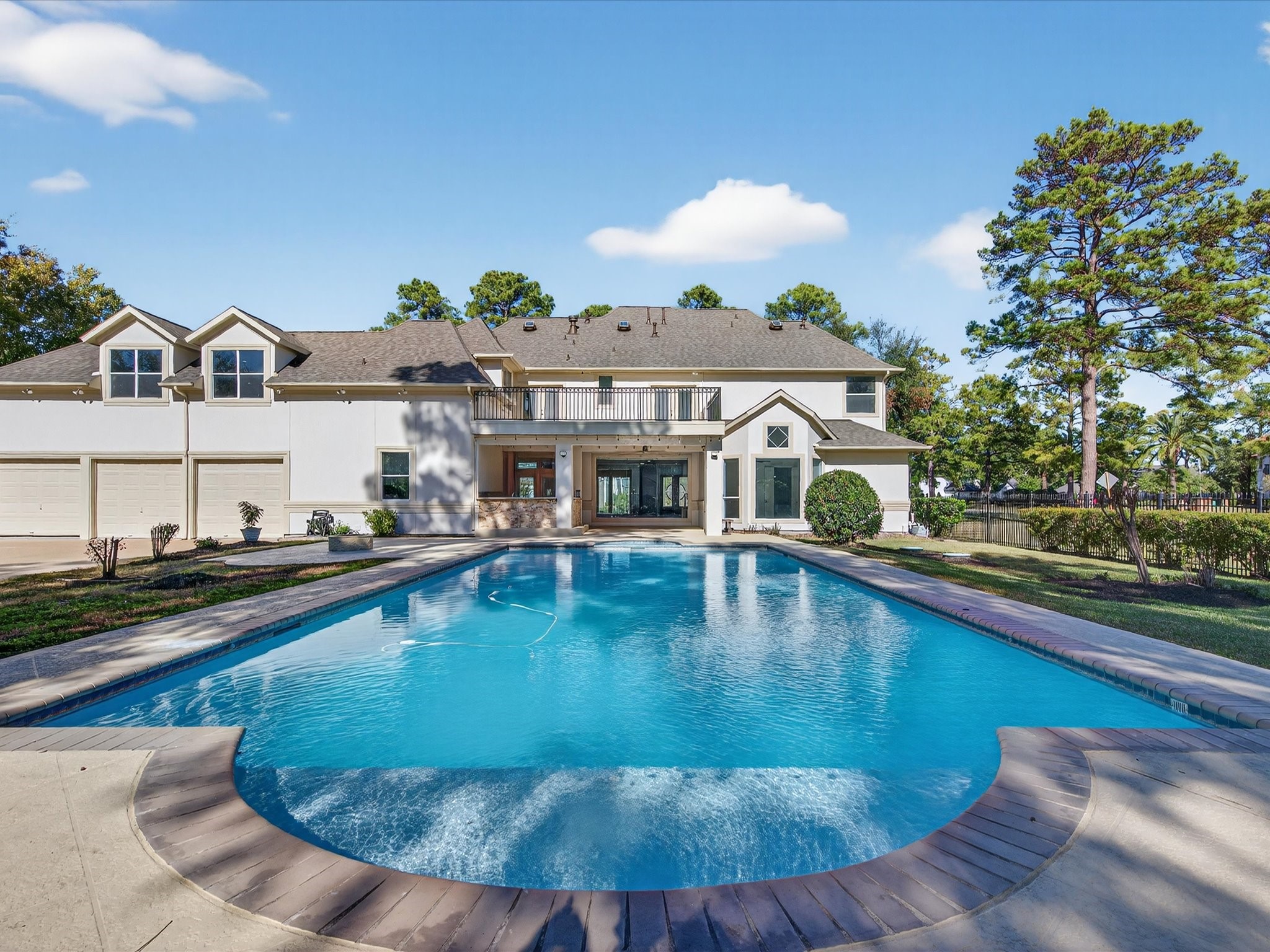11 Gleannloch Estates Drive Spring, TX 77379 - Photo 42 of 50 The pool area is immaculately maintained, offering a perfect blend of beauty, functionality, and leisure.