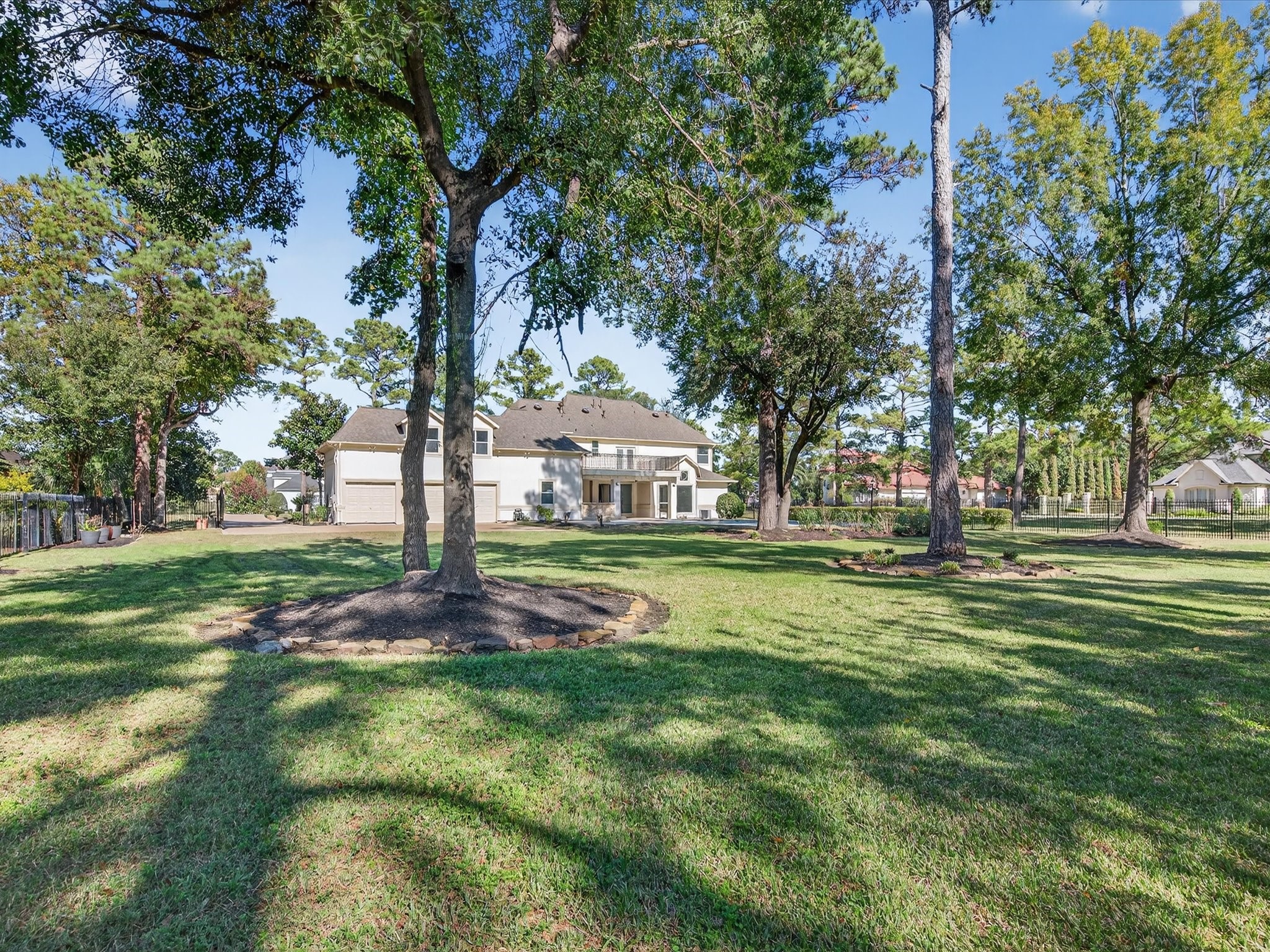 11 Gleannloch Estates Drive Spring, TX 77379 - Photo 43 of 50 Sitting on just over an acre, the property features lush landscaping and mature trees, creating a private and tranquil setting.