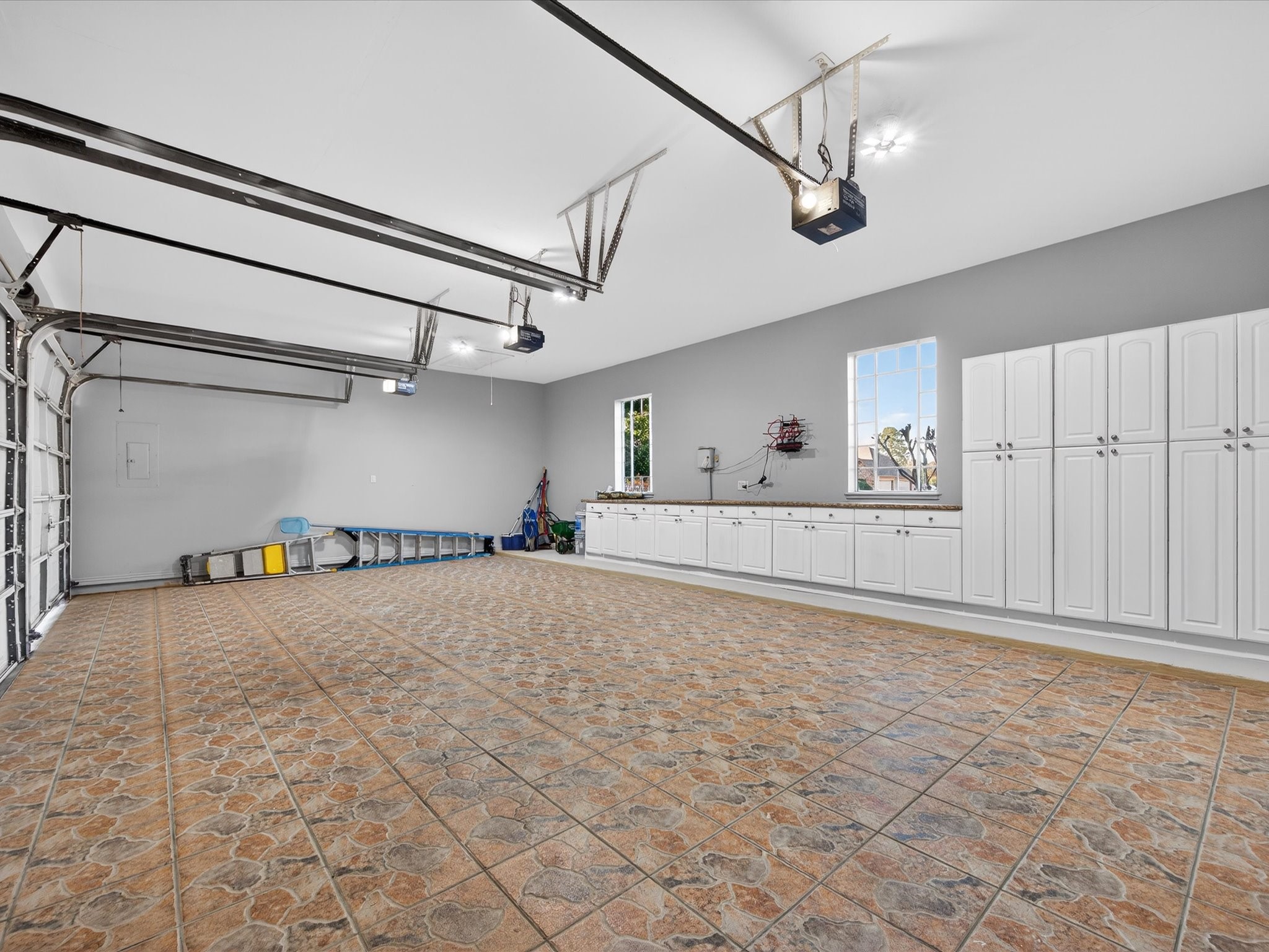 11 Gleannloch Estates Drive Spring, TX 77379 - Photo 45 of 50 The garage includes ample storage and workspace, complete with stamped concrete flooring for a polished, functional finish.
