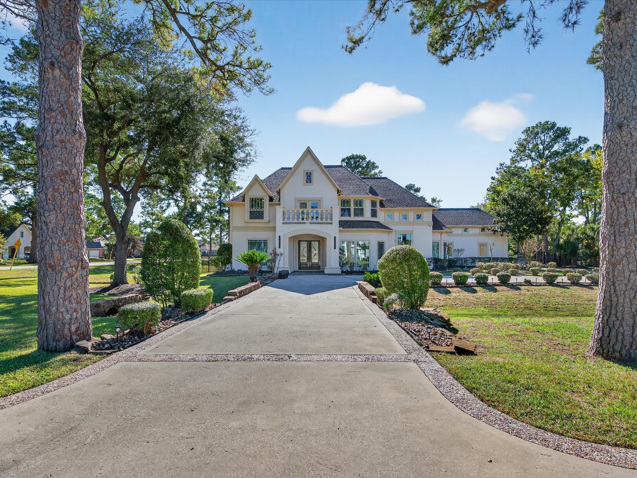 11 Gleannloch Estates Drive Spring, TX 77379 - Photo 5 of 50 Fresh exterior paint highlights the home’s refined facade, instantly setting a polished and vibrant tone.