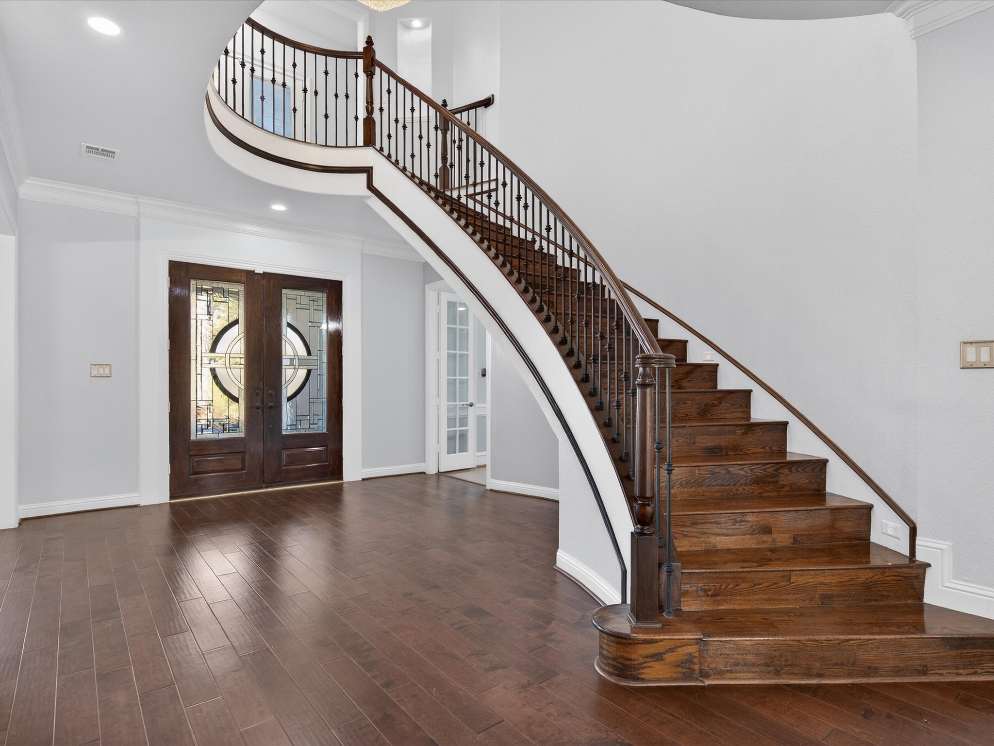 11 Gleannloch Estates Drive Spring, TX 77379 - Photo 9 of 50 Crown molding, hardwood floors, and fresh paint accentuate the home’s elegance, providing a polished backdrop for everyday life.