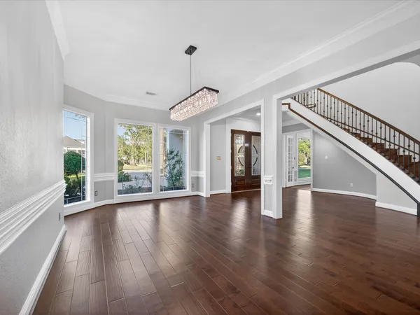 a view of an entryway with wooden floor