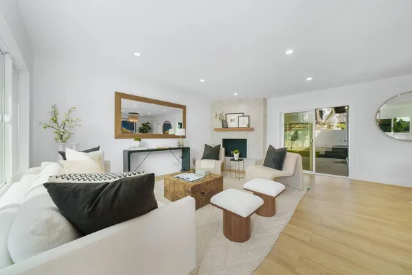 a living room with furniture and a fireplace
