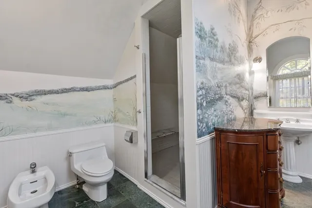 a bathroom with a granite countertop toilet a sink and a bathtub