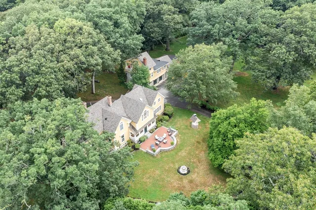 a front view of a house with a garden and plants