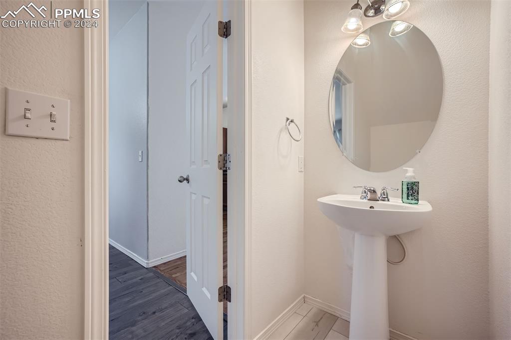 10581 Wells Point Fountain, CO 80817 - Photo 12 of 23 a bathroom with a sink and a mirror