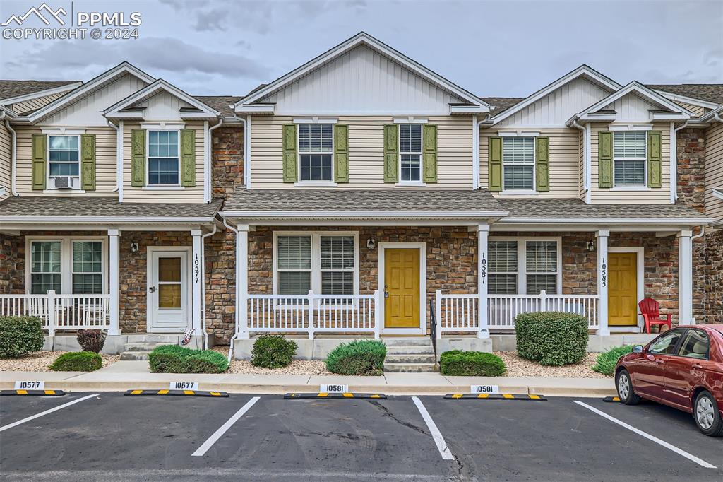 10581 Wells Point Fountain, CO 80817 - Photo 23 of 23 a front view of a house with a yard and potted plants
