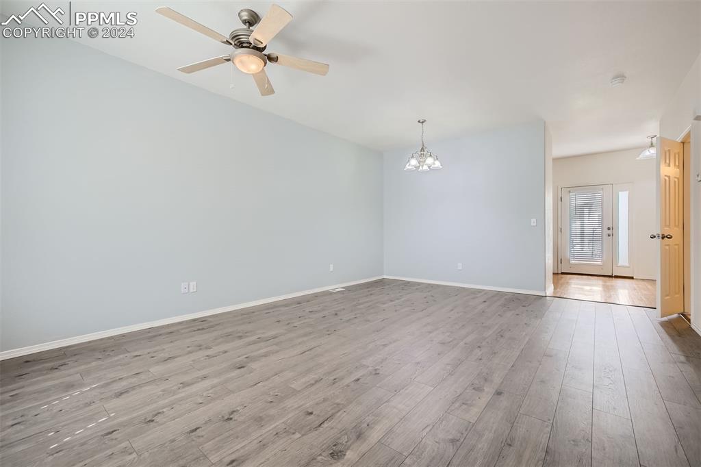 10581 Wells Point Fountain, CO 80817 - Photo 4 of 23 wooden floor in an empty room with a window