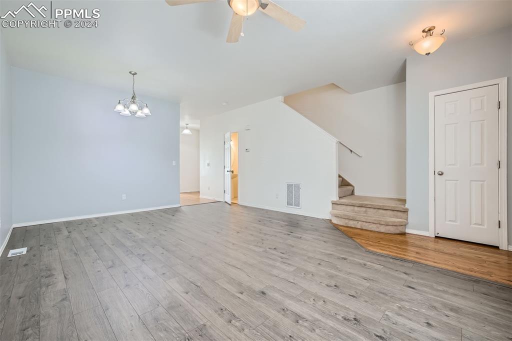 10581 Wells Point Fountain, CO 80817 - Photo 5 of 23 a view of empty room with wooden floor and fan