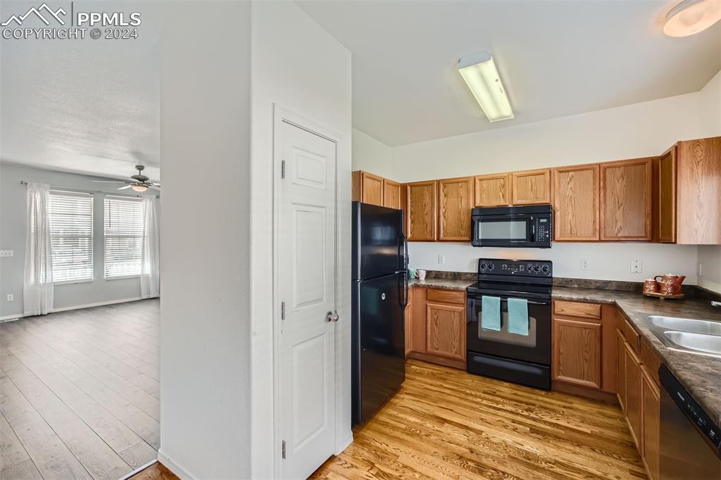 10581 Wells Point Fountain, CO 80817 - Photo 8 of 23 a kitchen with stainless steel appliances granite countertop a refrigerator and a stove top oven